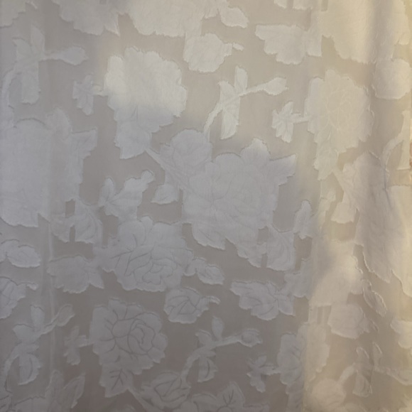 Zulily top in XXL has embossed flowers It’s  lining the sleeve are see-threw - Picture 2 of 15